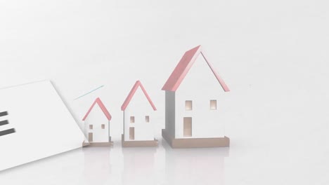 Animation-Des-Verkaufstextes-Mit-Häusern-Auf-Weißem-Hintergrund