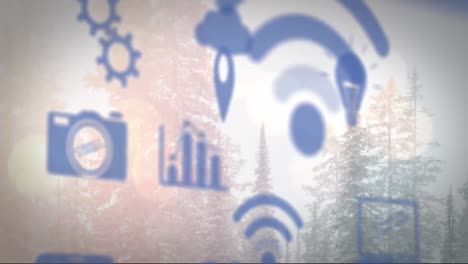 Animation-of-wifi-and-digital-icons-floating-over-winter-landscape