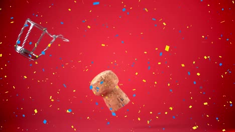 Confetti-falling-over-wine-cork-and-opener-falling-against-red-background