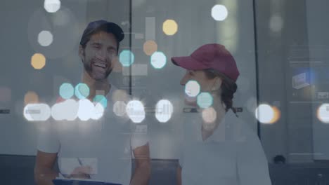 Spots-of-bokeh-light-against-portrait-of-caucasian-delivery-man-and-woman-smiling