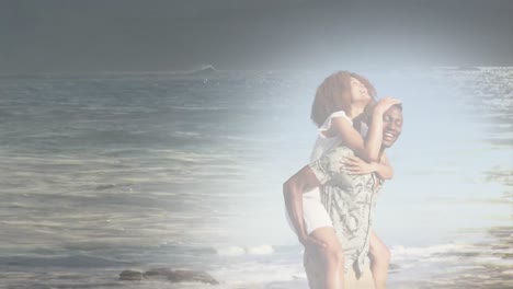 Animation-of-happy-african-american-couple-having-fun-piggybacking-at-beach-over-sea