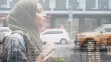 Animation-of-asian-woman-in-hijab-with-salad-over-cityscape
