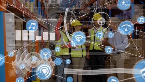 Data-processing-and-network-of-digital-icons-against-team-of-workers-discussing-at-warehouse