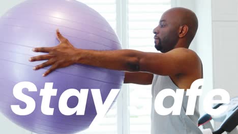 Animation-os-stay-safe-text-over-man-exercising-with-swiss-ball-at-home