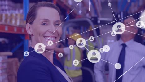 Network-of-profile-icons-against-portrait-of-caucasian-female-supervisor-smiling-at-warehouse