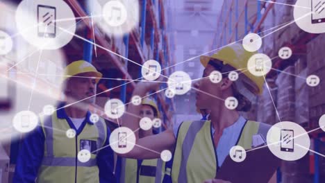Network-of-digital-icons-against-team-of-male-and-female-workers-checking-stock-at-warehouse