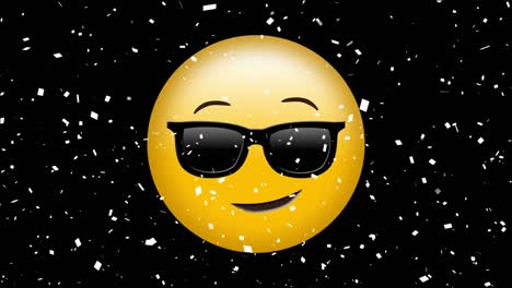 Digital-animation-of-confetti-falling-over-face-wearing-sunglasses-emoji-against-black-background