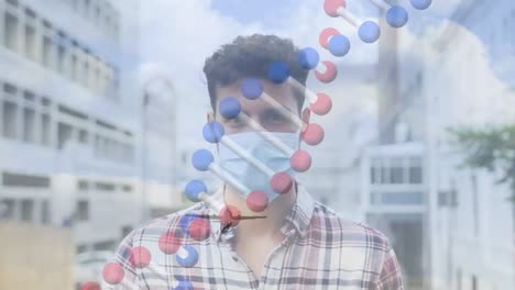 Animation-of-dna-strand-spinning-over-man-wearing-face-mask