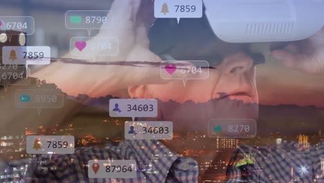 Animation-of-social-media-notifications-over-man-in-vr-headset-and-city-buildings