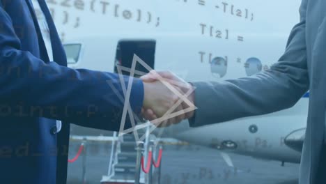 Abstract-shape-and-data-processing-on-mid-section-of-two-businessmen-shaking-hands-at-airport-runway