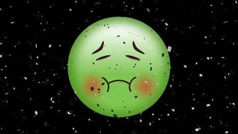 Digital-animation-of-confetti-falling-over-green-sick-face-emoji-on-black-background