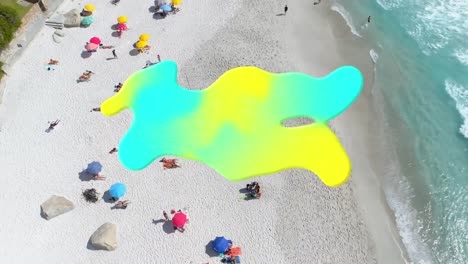 Digital-composition-of-gradient-abstract-shape-with-copy-space-against-aerial-view-of-the-beach