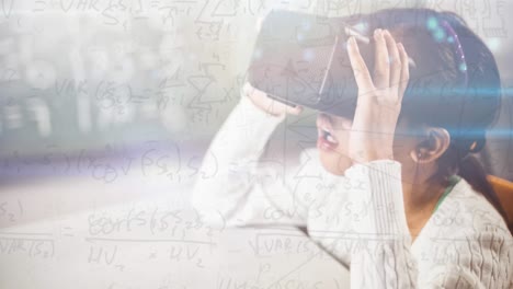 Animation-of-mathematical-equations-over-schoolgirl-wearing-vr-goggles