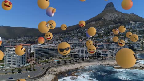 Digitale-Komposition-Mehrerer-Gesichts-Emojis,-Die-Vor-Der-Luftaufnahme-Der-Stadtlandschaft-Schweben