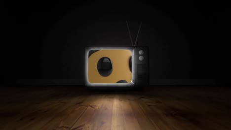 Weinendes-Gesicht-Emoji-Auf-Fernsehbildschirm-über-Holzoberfläche-Vor-Schwarzem-Hintergrund