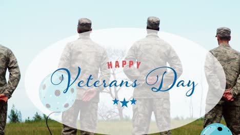 Composition-of-happy-veterans-day-text-and-balloons,-over-rear-view-of-three-soldiers