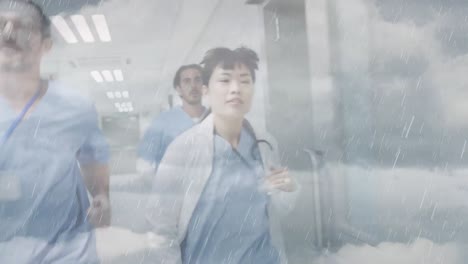 Animation-of-clouds-and-sky-over-doctors-running-in-hospital
