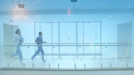 Animation-of-glowing-light-over-doctors-running-in-hospital