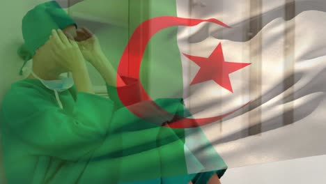 Digital-composition-of-algeria-flag-waving-against-stressed-caucasian-female-surgeon-at-hospital