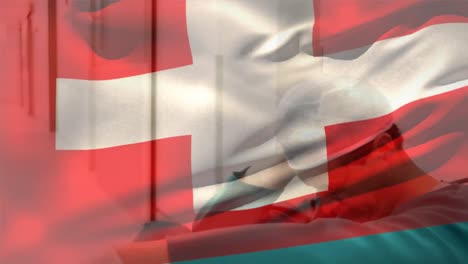 Digital-composition-of-switzerland-flag-waving-over-stressed-caucasian-male-surgeon-at-hospital