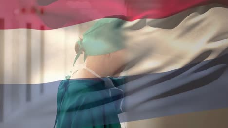 Digital-composition-of-netherlands-flag-waving-stressed-caucasian-female-surgeon-at-hospital
