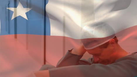 Digitale-Komposition-Einer-Chilenischen-Flagge,-Die-Im-Krankenhaus-Gegen-Einen-Gestressten-Kaukasischen-Chirurgen-Weht