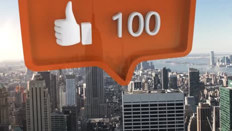 Like-icon-with-increasing-numbers-on-orange-speech-bubble-against-aerial-view-of-cityscape