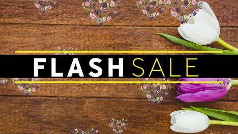 Flash-sale-text-banner-over-floral-designs-in-heart-shape-floating-and-daisies-on-wooden-surface