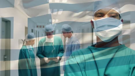 Animation-of-flag-of-greece-waving-over-surgeons-in-face-masks