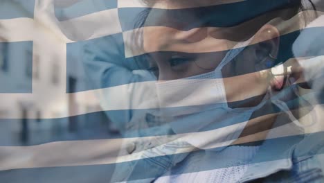 Animation-of-flag-of-greece-waving-over-woman-in-face-masks