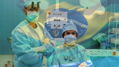 Animation-of-flag-of-brazil-waving-over-surgeons-in-face-masks