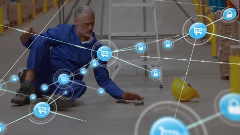 Animation-of-network-of-connections-over-man-falling-while-working-in-warehouse