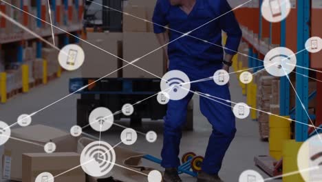 Animation-of-network-of-connections-over-man-falling-while-working-in-warehouse