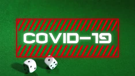 Animation-of-covid-19-text-over-two-dice-on-green-background