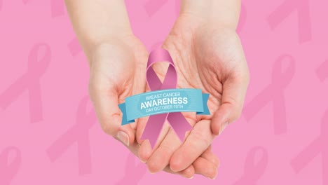 Animation-of-pink-ribbon-logo-with-breast-cancer-text-over-hands-on-pink-background