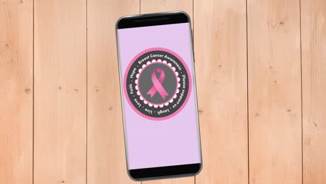 Animation-Des-Rosafarbenen-Brustkrebsband-Logos-Mit-Brustkrebstext-Auf-Dem-Smartphone-Bildschirm