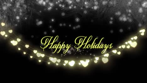 Animation-of-happy-holidays-text-over-hearts-and-snow-falling-on-black-background