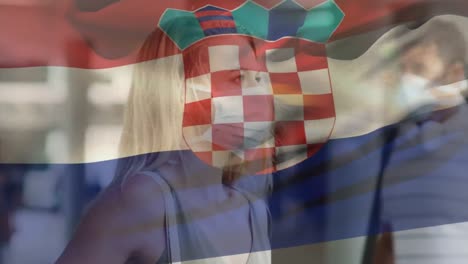 Animation-of-flag-of-croatia-over-woman-wearing-face-mask