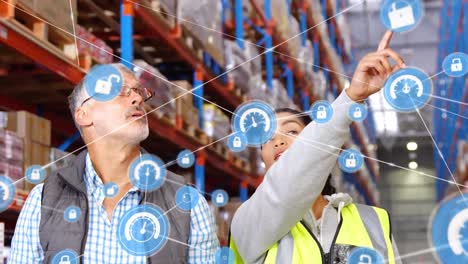 Animation-of-networks-of-connections-with-icons-over-people-working-in-warehouse