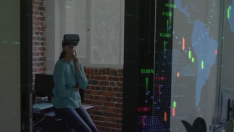 Animation-of-financial-data-processing-over-businesswoman-wearing-vr-headset-in-office