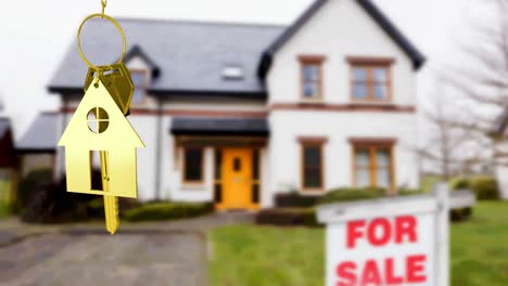 Animation-of-gold-house-key-fob-and-key,-hanging-in-front-of-blurred-house-with-for-sale-sign
