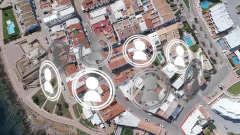 Animation-of-ring-of-people-icons-rotating-over-aerial-view-modern-buildings