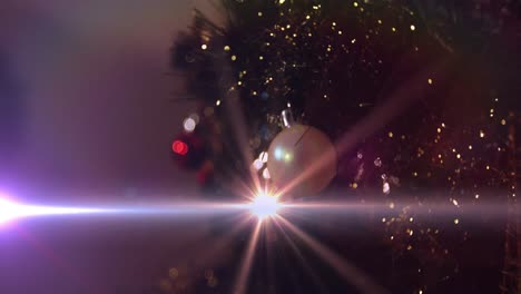 Animation-of-glowing-lights-moving-over-christmas-baubles-and-decorations
