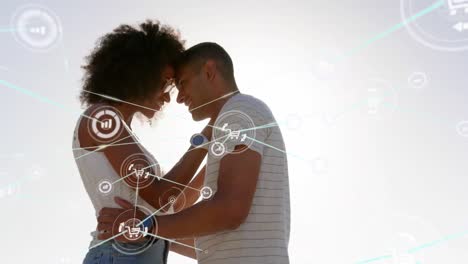 Animation-of-network-of-connections-over-happy-couple-on-the-beach