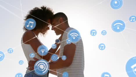 Animation-of-network-of-connections-over-happy-couple-on-the-beach