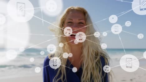 Animation-of-network-of-connections-over-happy-woman-on-the-beach