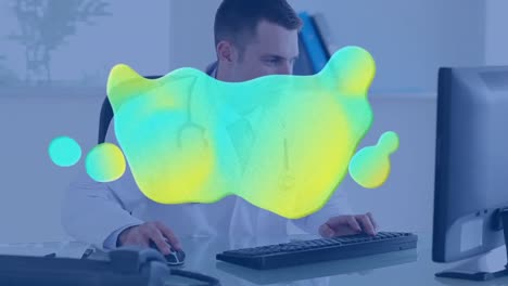 Animation-of-blue-and-yellow-stain-over-doctor-using-computer