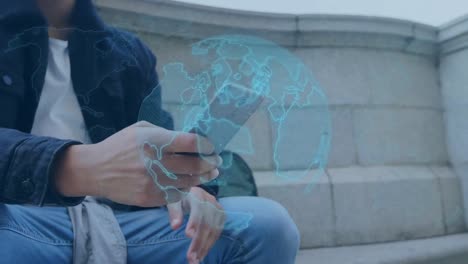 Animation-of-digital-globe-over-man-using-smartphone