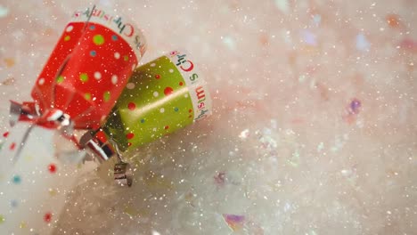 Animation-of-snow-falling-over-close-up-of-christmas-sweets
