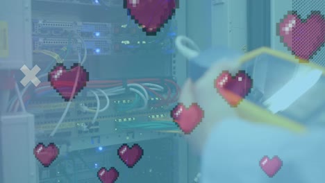 Animation-of-digital-heart-icons-over-server-room
